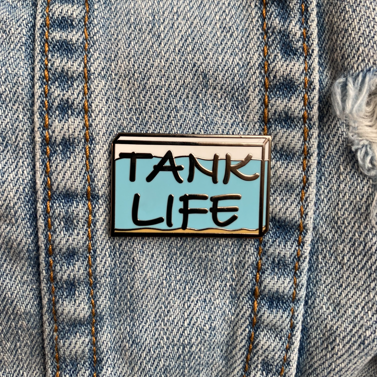 Tank Life Apparel Aquarium Logo hard enamel pin. fish tank pin.